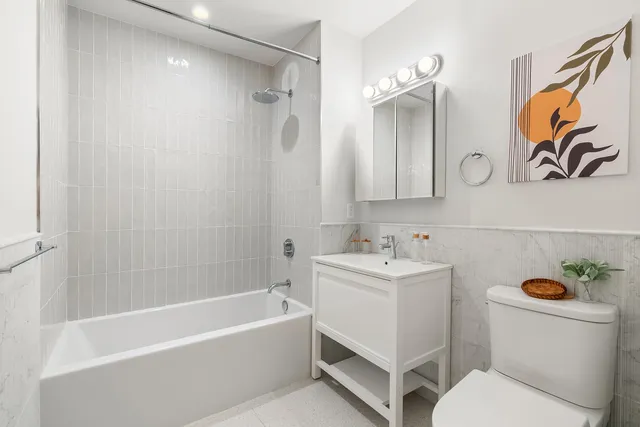 a bathroom with a sink a toilet and a bathtub