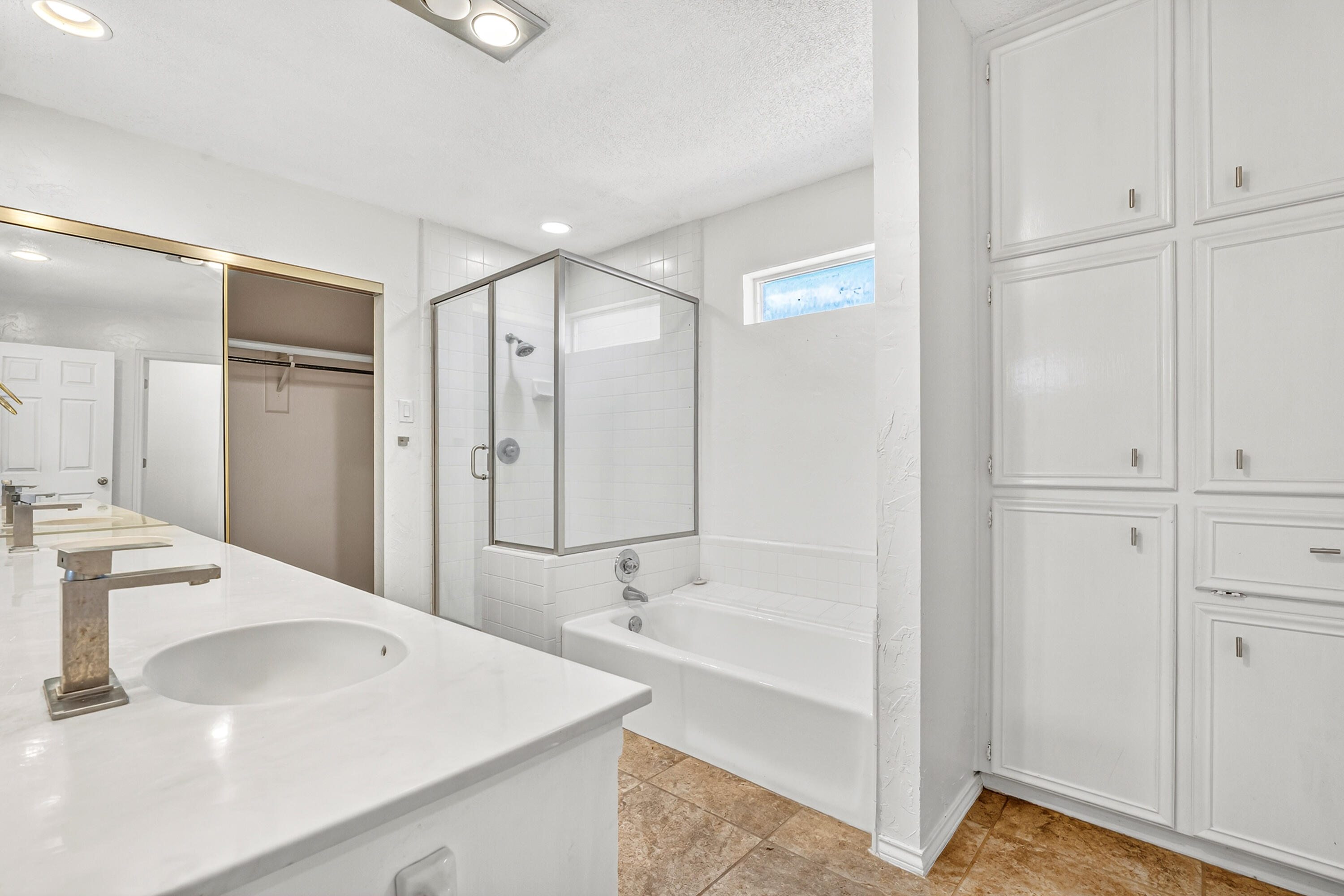 5221 84th Street Lubbock, TX 79424 - Photo 16 of 26 a bathroom with a bathtub and a sink