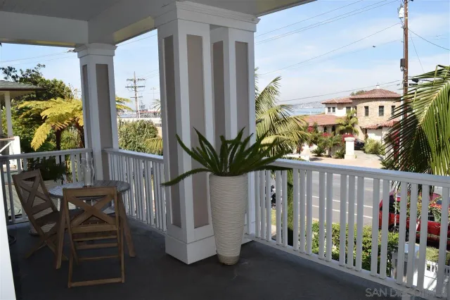 a view of balcony with furniture