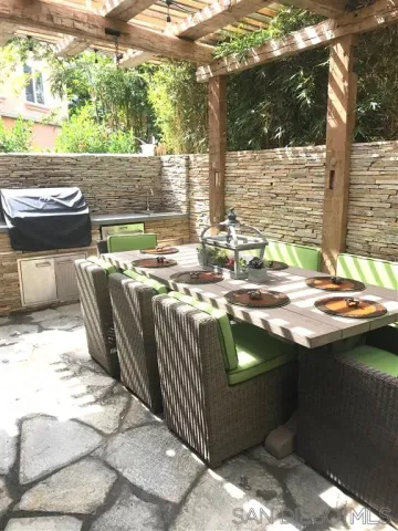 a view of swimming pool with outdoor seating