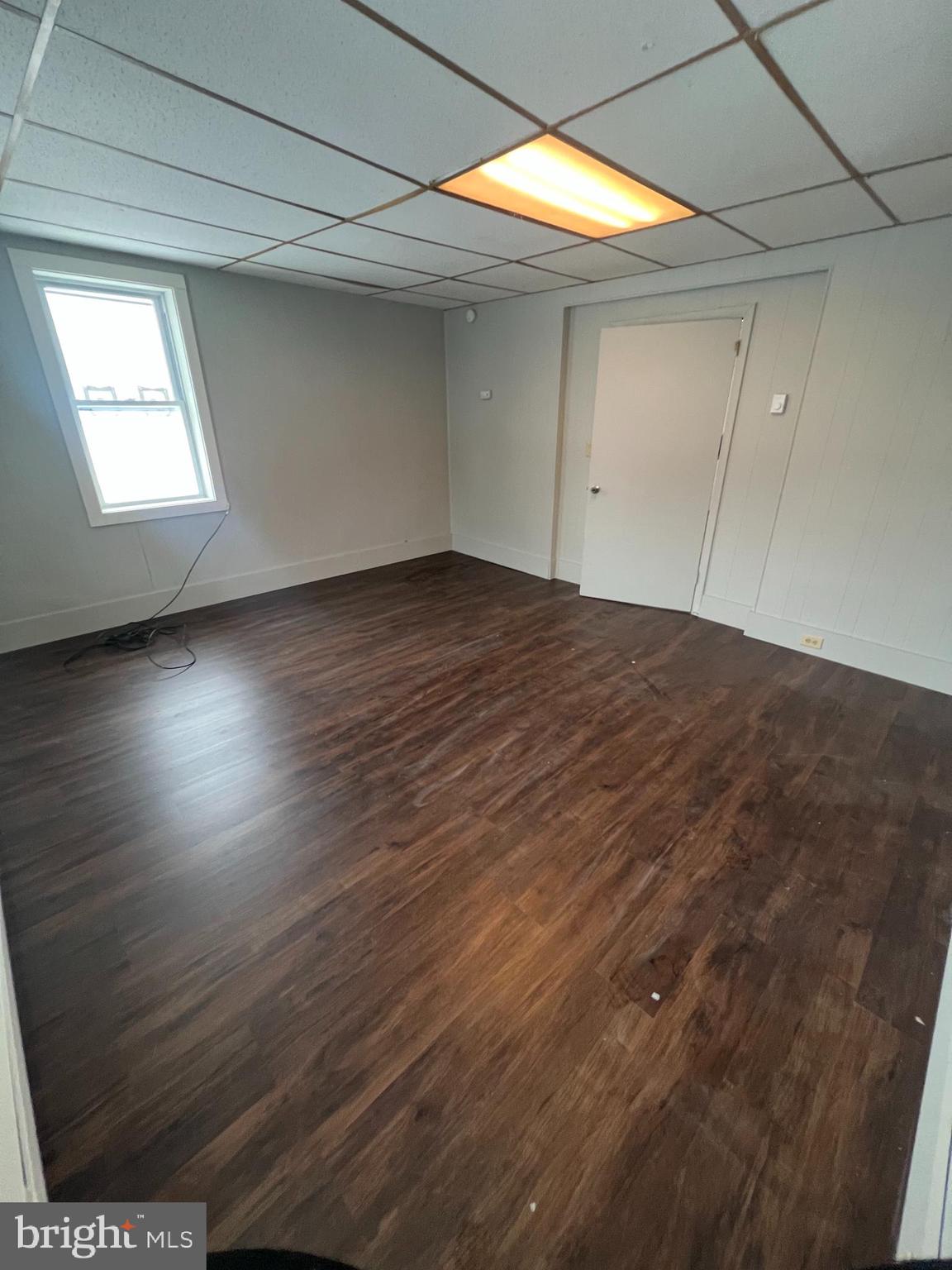 544 North 8th Street, Unit 2 Lebanon, PA 17046 - Photo 5 of 7 an empty room with wooden floor and windows