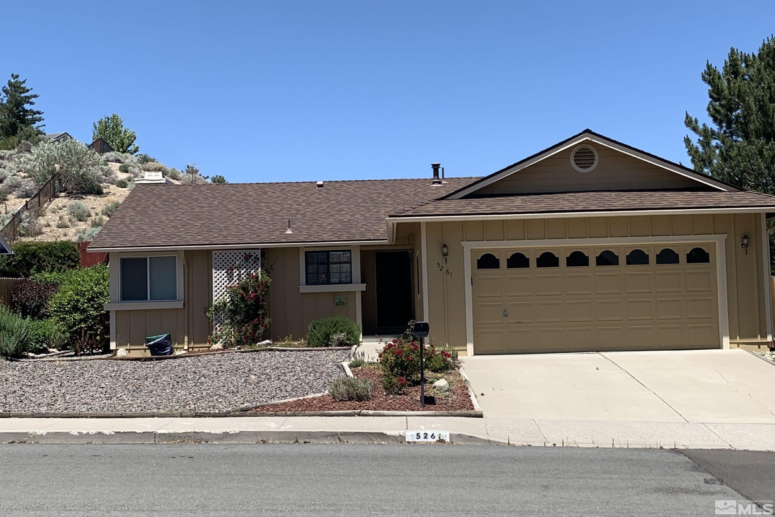 5261 Coit Drive Reno, NV 89523 - Photo 1 of 11 a front view of a house with a yard
