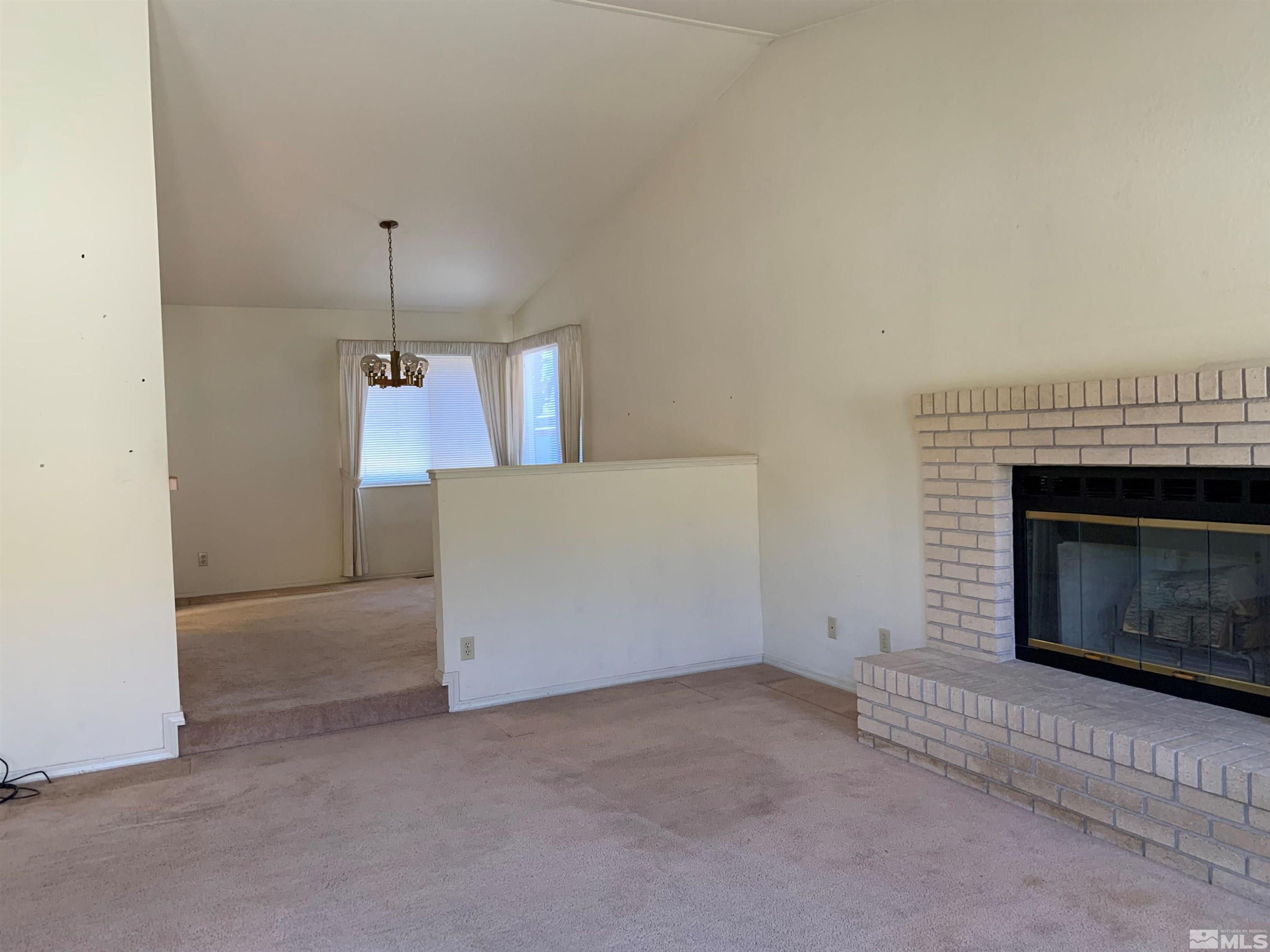 5261 Coit Drive Reno, NV 89523 - Photo 5 of 11 an empty room with a fireplace