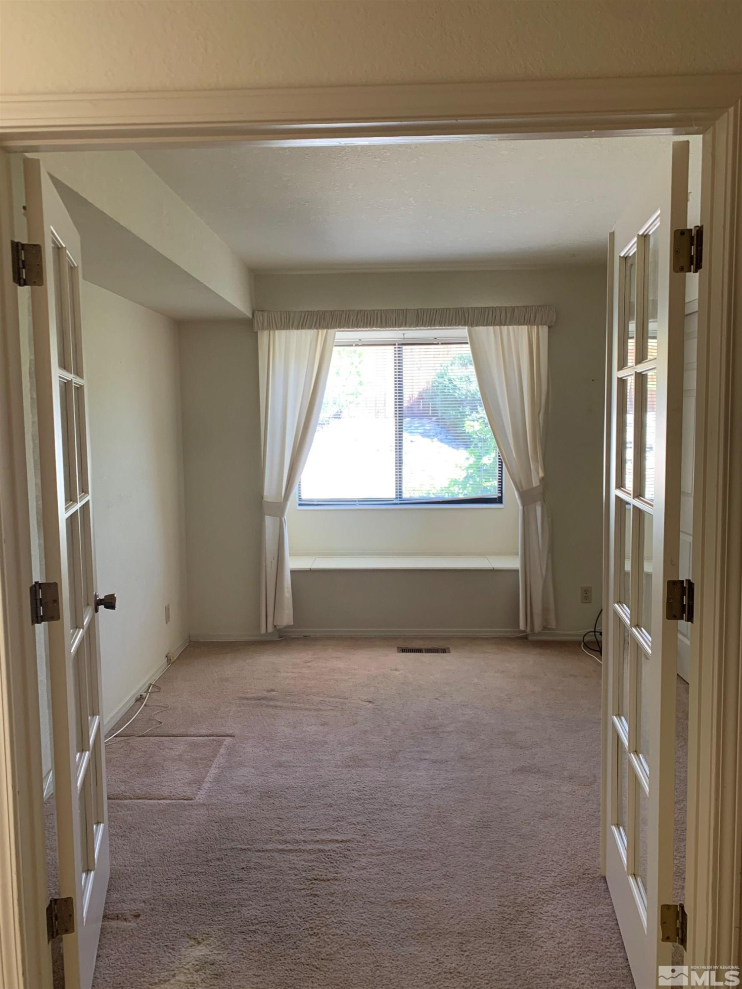 5261 Coit Drive Reno, NV 89523 - Photo 8 of 11 a view of an empty room with a window