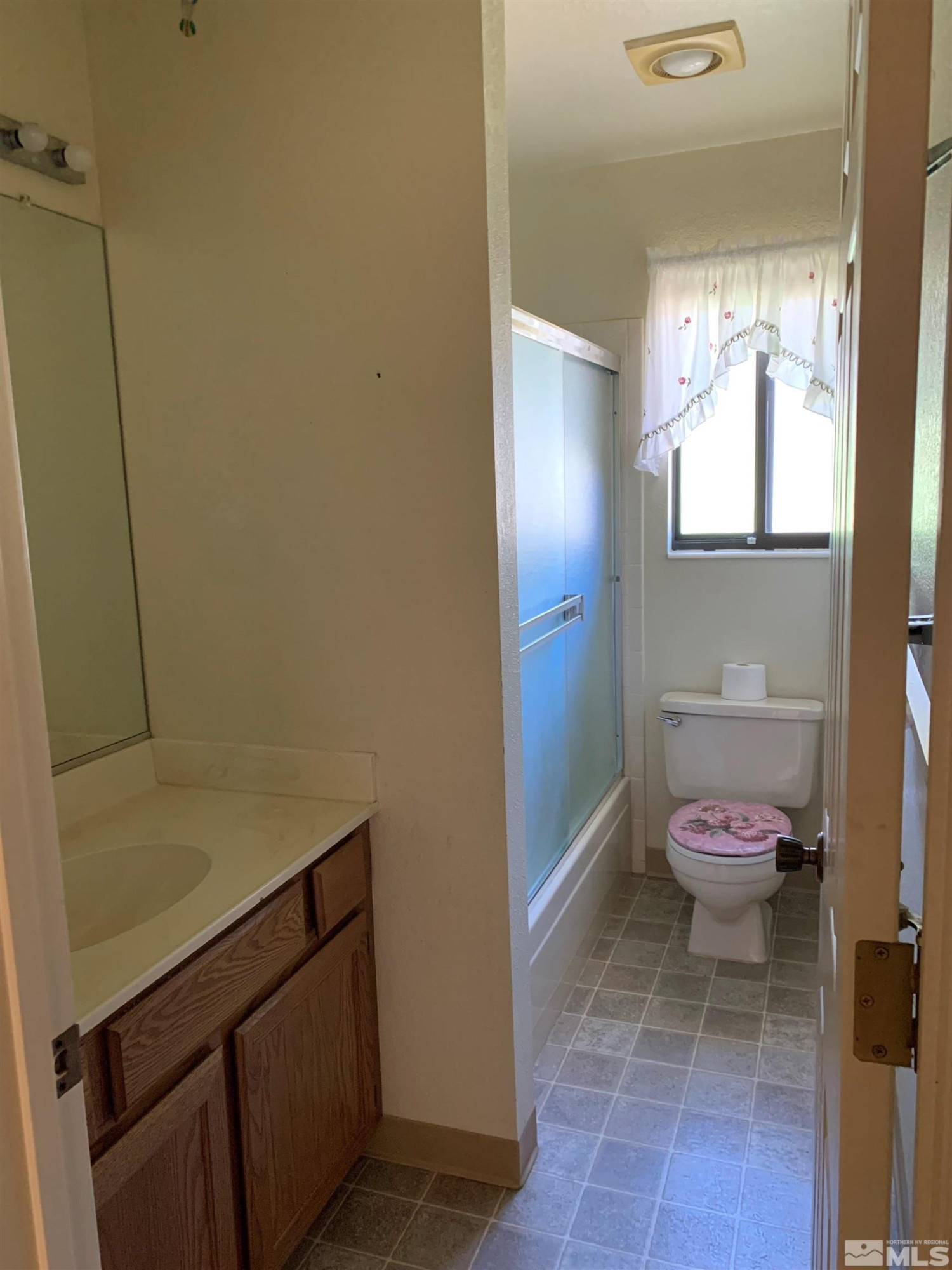 5261 Coit Drive Reno, NV 89523 - Photo 9 of 11 a bathroom with a sink and a toilet