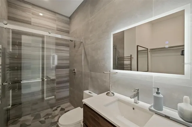 a view of swimming pool with outdoor seating and city view