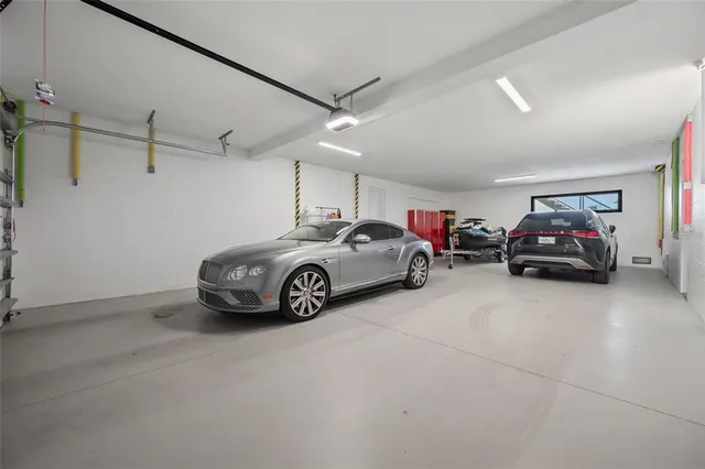 a view of swimming pool with a table and chairs under an umbrella