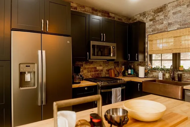 a bathroom with a sink vanity granite and a mirror