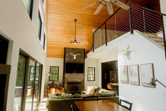 a spacious bedroom with a bed and a window