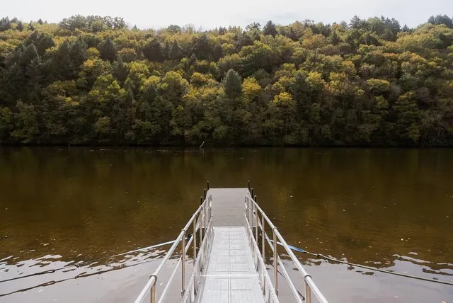 a view of house with trees in front of it