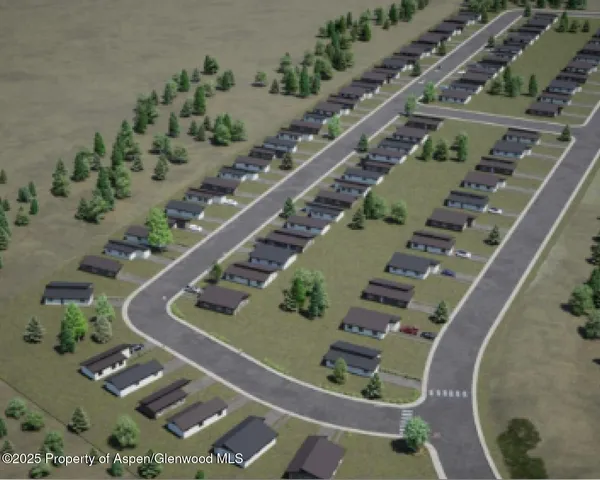 an aerial view of a residential houses with outdoor space