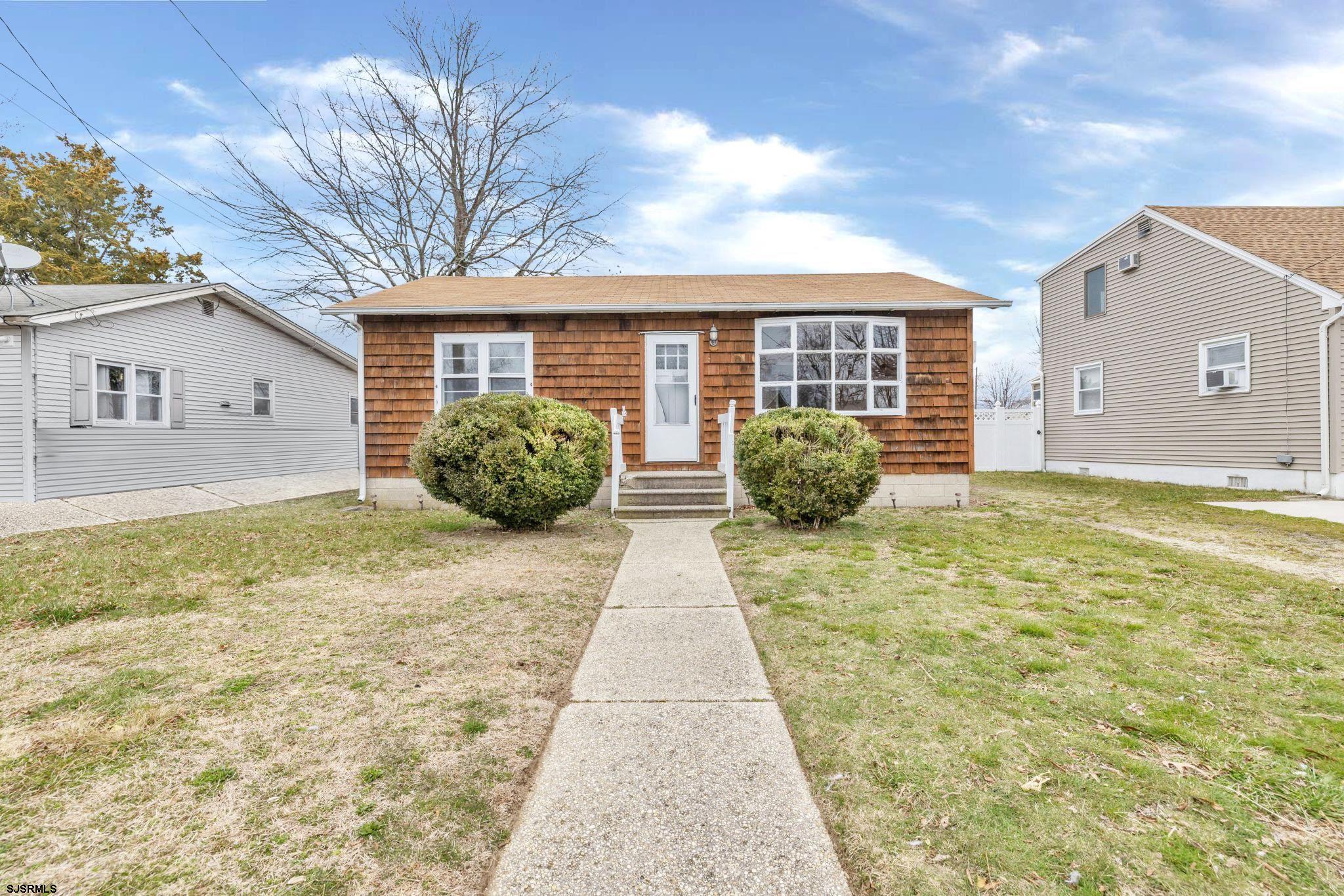 19 Arbor Road Villas, NJ 08251 - Photo 1 of 33 a view of a brick house with large windows
