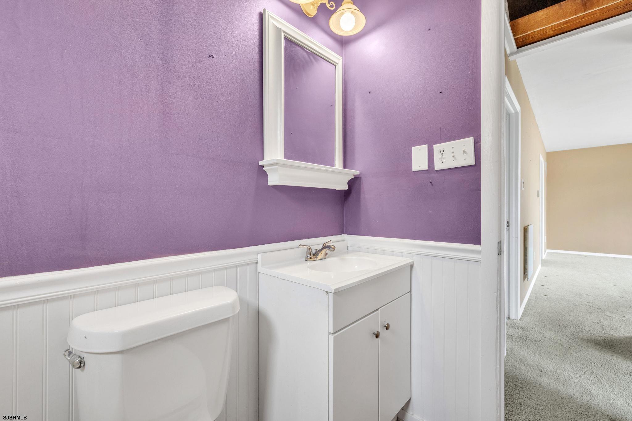 19 Arbor Road Villas, NJ 08251 - Photo 16 of 33 a bathroom with a sink a vanity and a mirror
