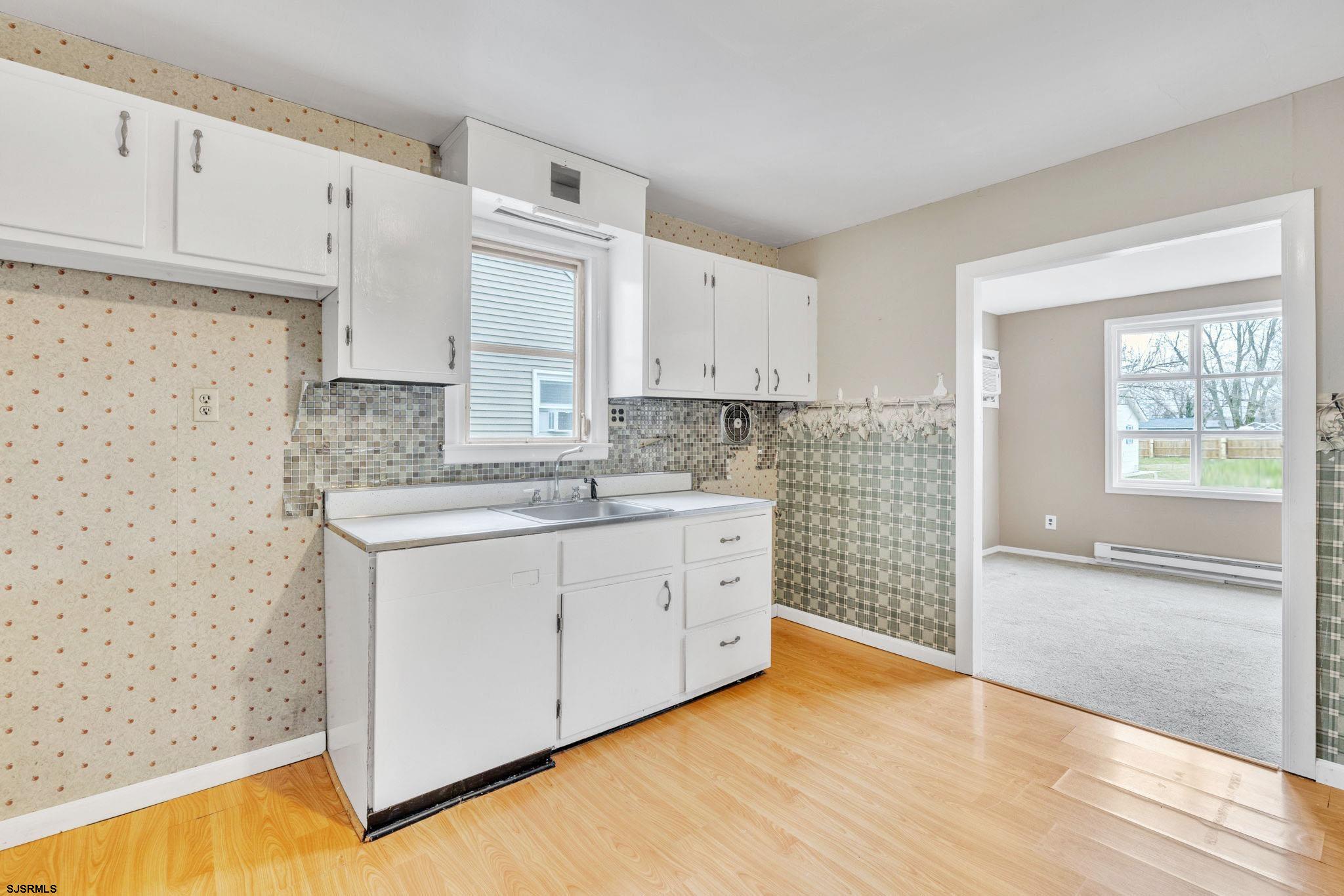 19 Arbor Road Villas, NJ 08251 - Photo 18 of 33 a view of kitchen with granite countertop cabinets and sink