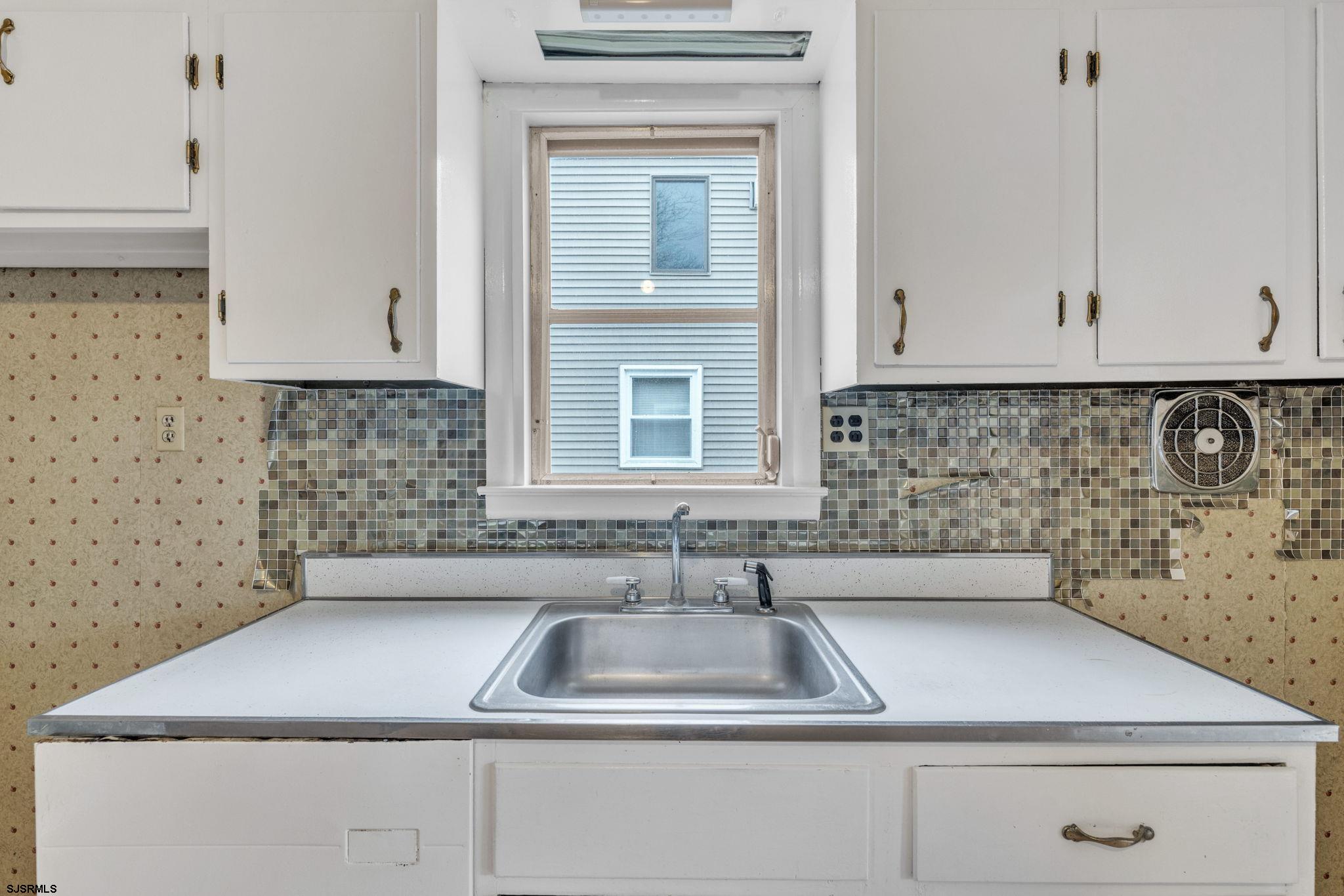 19 Arbor Road Villas, NJ 08251 - Photo 20 of 33 a kitchen with a sink cabinets and window