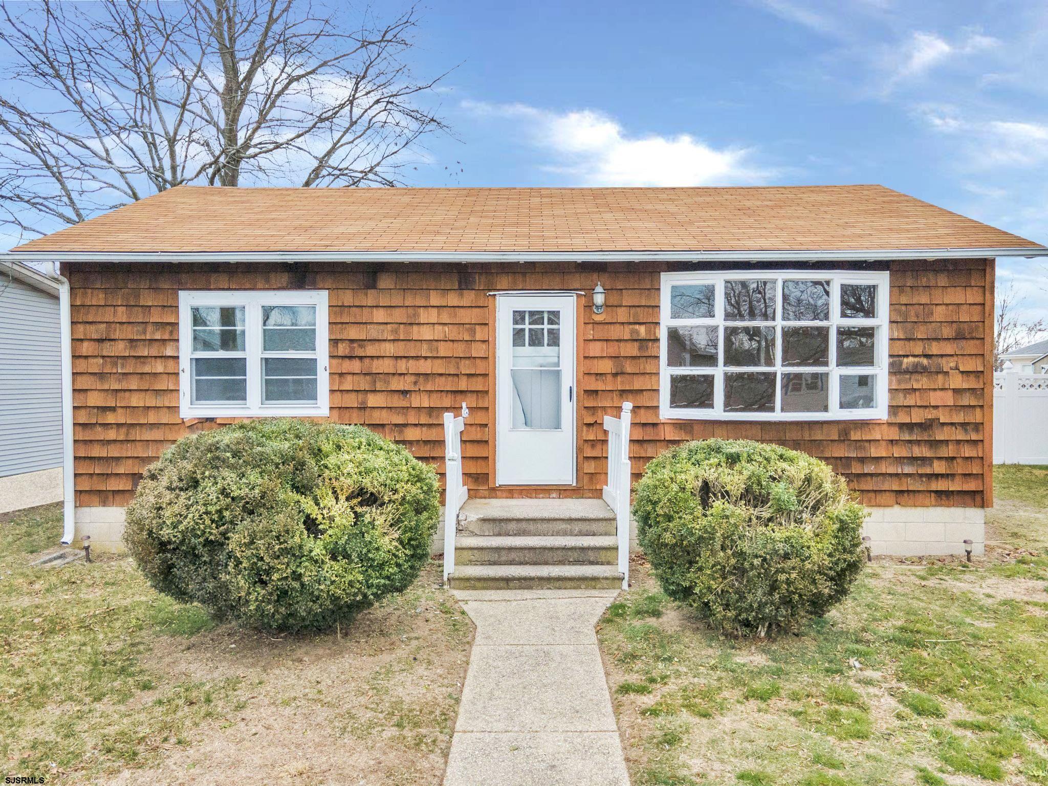 19 Arbor Road Villas, NJ 08251 - Photo 23 of 33 a front view of a house with garden