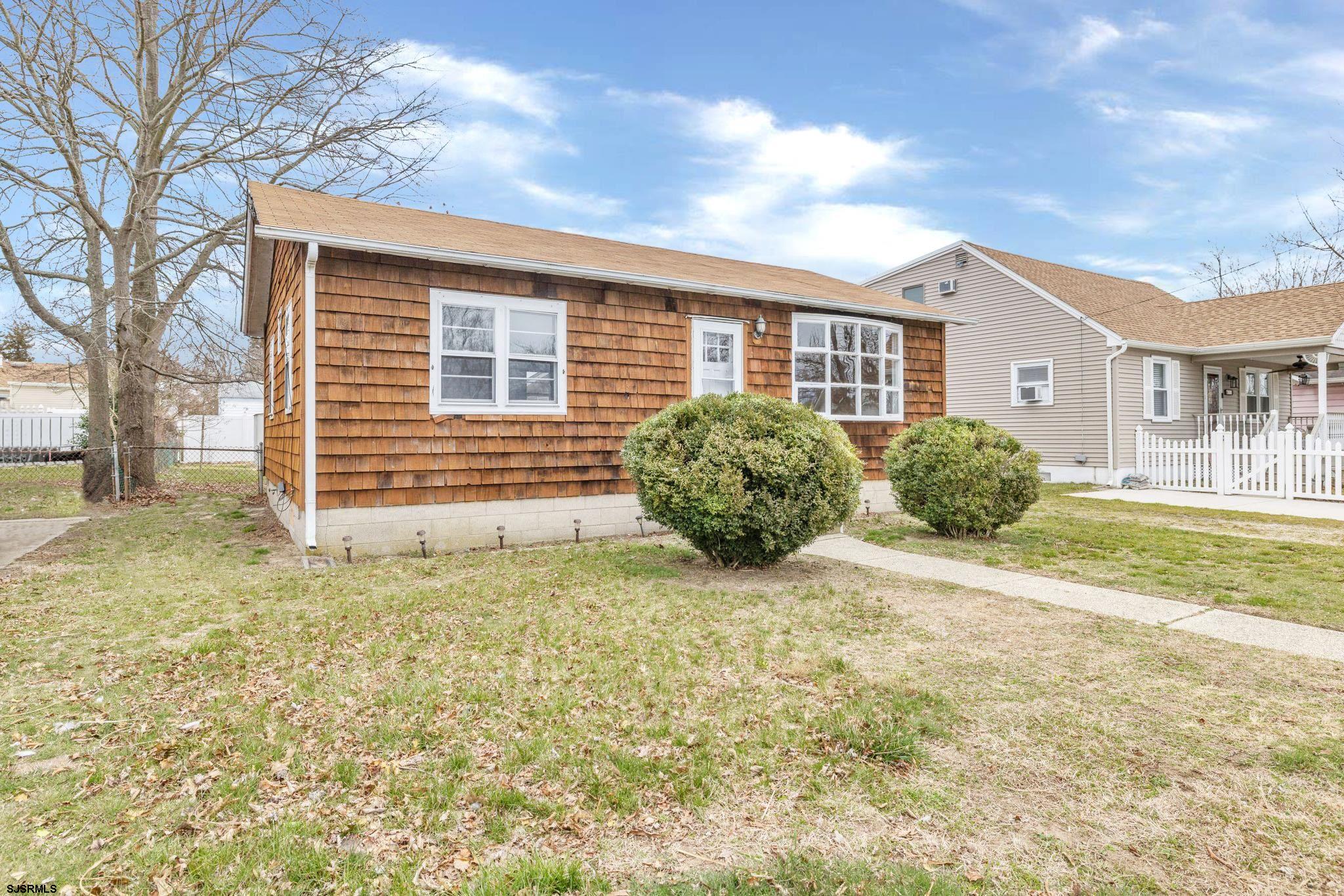 19 Arbor Road Villas, NJ 08251 - Photo 25 of 33 a view of a house with a yard
