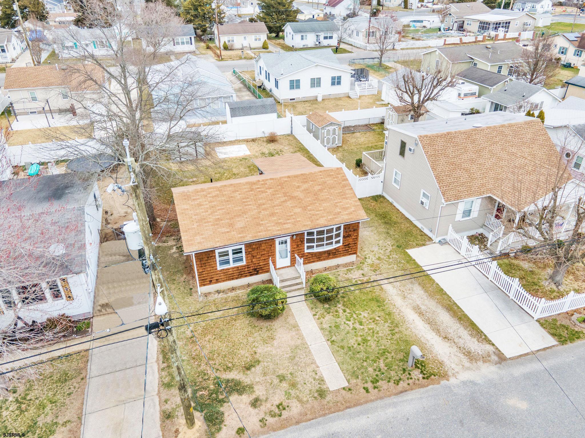 19 Arbor Road Villas, NJ 08251 - Photo 27 of 33 an aerial view of a house with a swimming pool