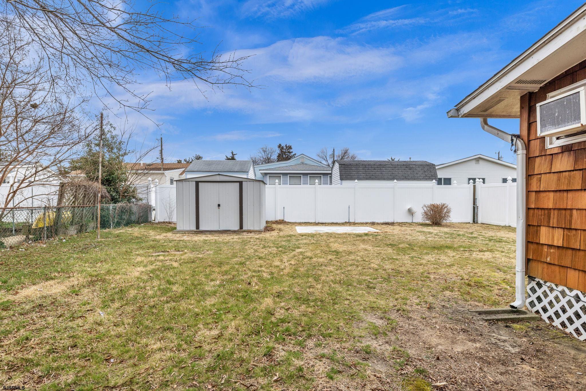 19 Arbor Road Villas, NJ 08251 - Photo 3 of 33 a view of a large house with a yard