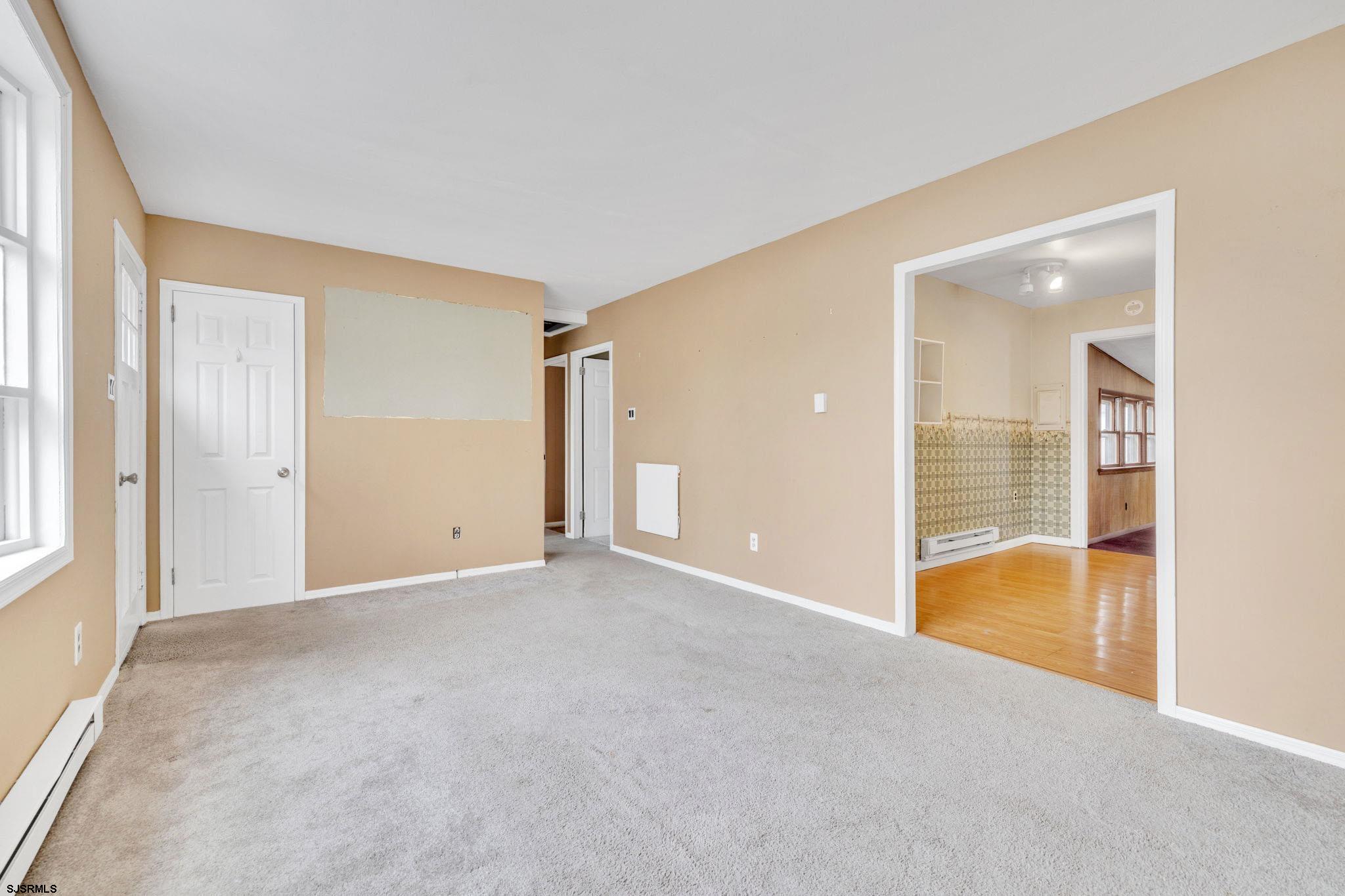 19 Arbor Road Villas, NJ 08251 - Photo 6 of 33 an empty room with a empty space and windows