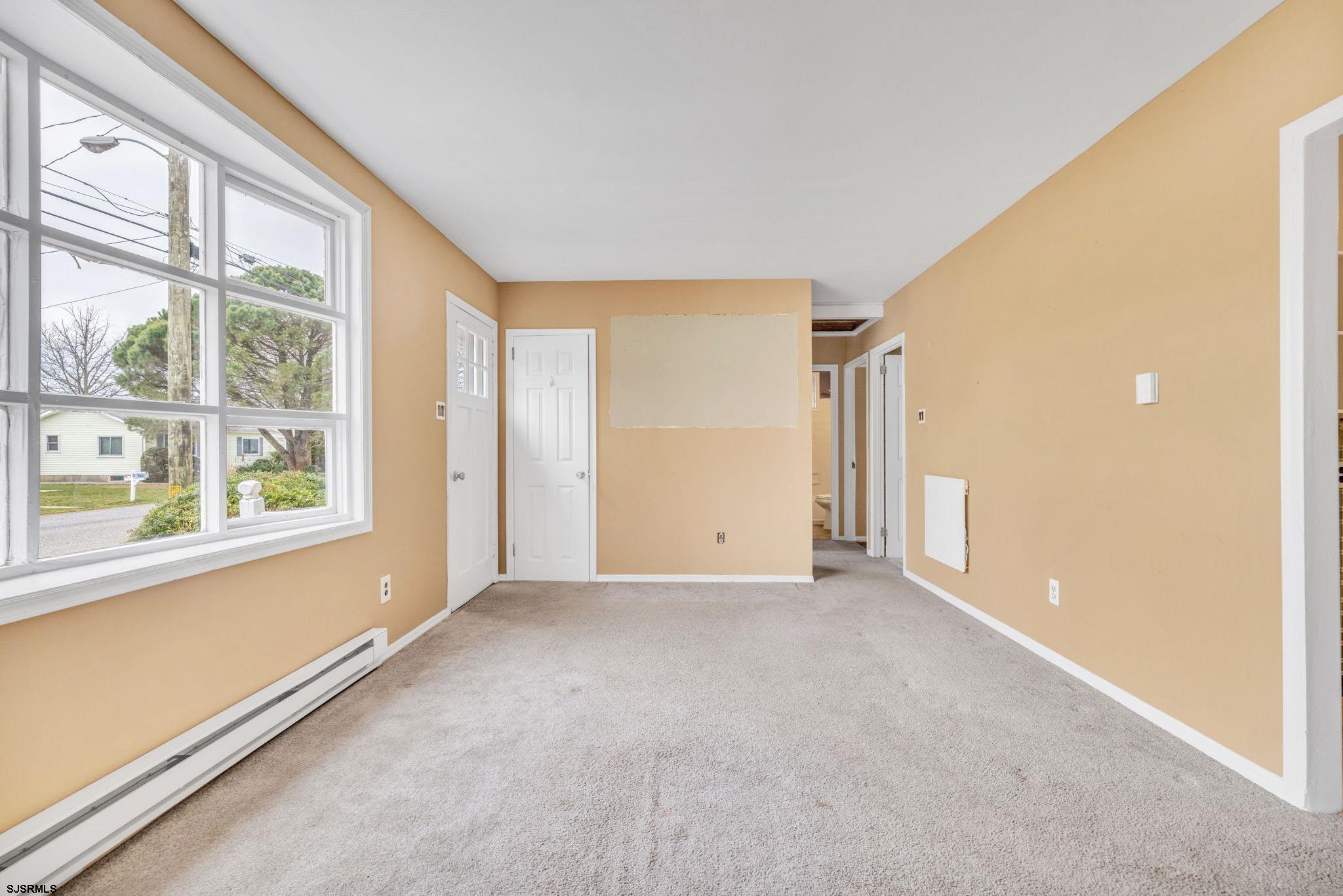 19 Arbor Road Villas, NJ 08251 - Photo 7 of 33 an empty room with windows