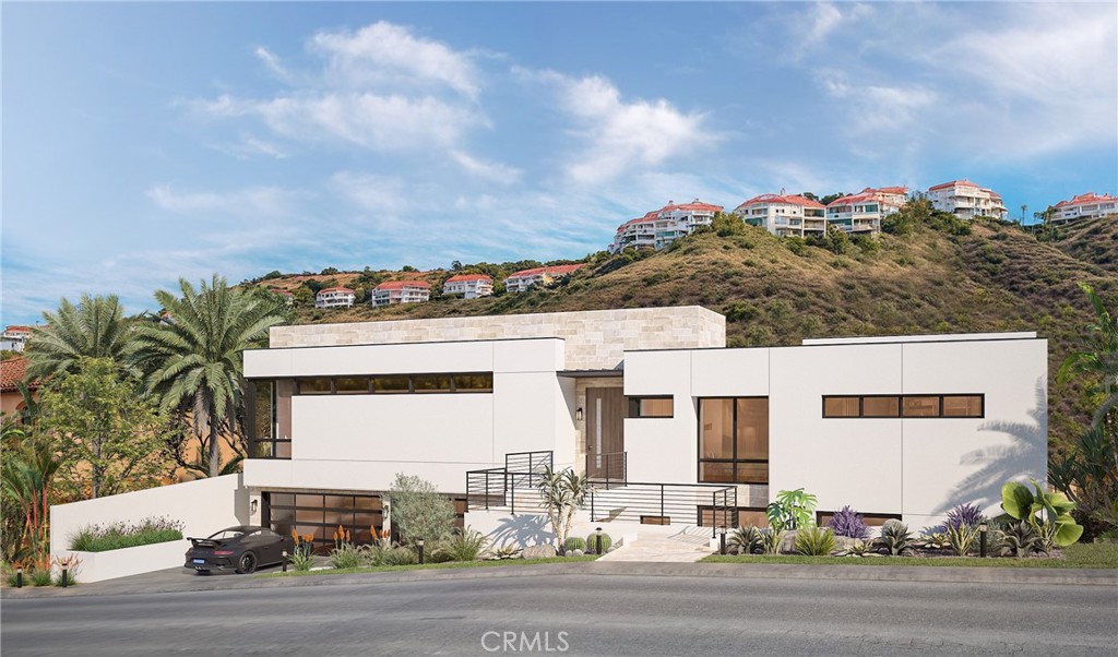 5 Le Conte Laguna Niguel, CA 92677 - Photo 2 of 13 a front view of a house with a yard and garage