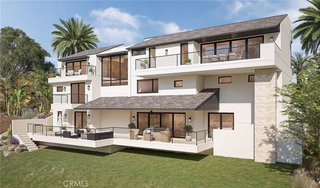 a front view of a house with a yard table and chairs