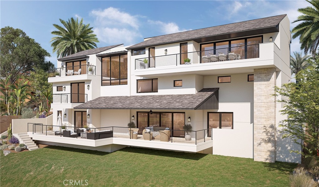 5 Le Conte Laguna Niguel, CA 92677 - Photo 6 of 13 a front view of a house with a yard table and chairs