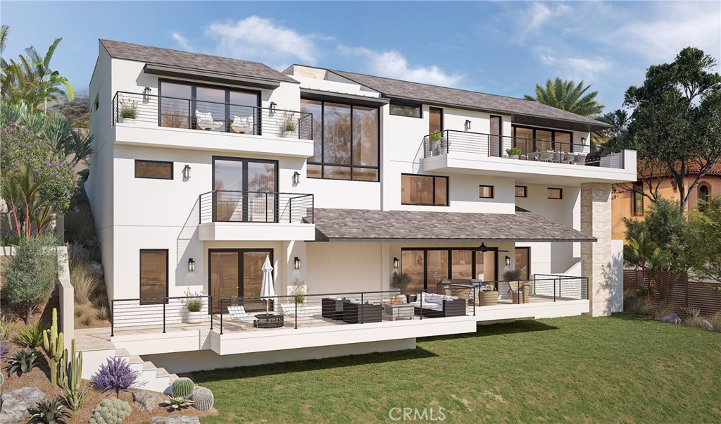 5 Le Conte Laguna Niguel, CA 92677 - Photo 7 of 13 a front view of a residential apartment building with a yard table and chairs