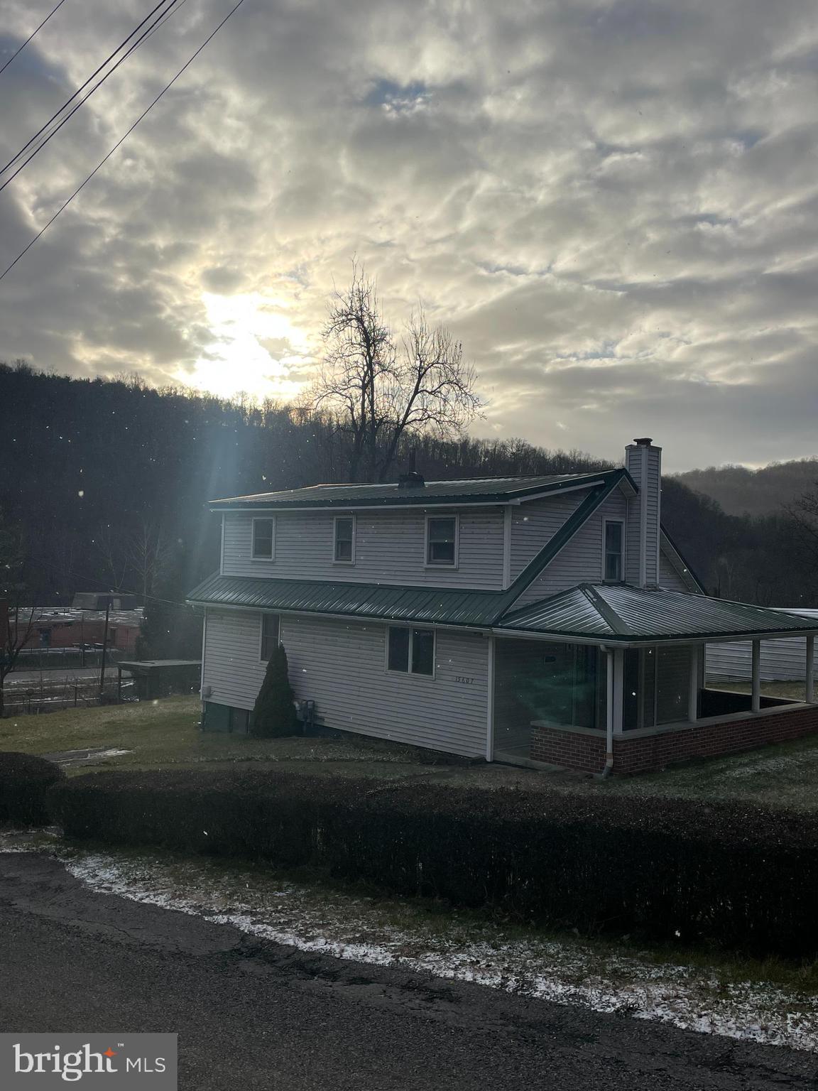 15607 Old Coney Cemetery Road Southwest Lonaconing, MD 21539 - Photo 2 of 34 a front view of a house with a yard