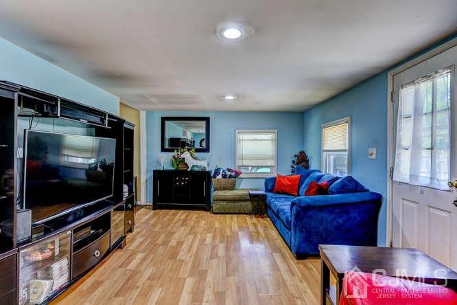 50 Ashley Road Edison, NJ 08817 - Photo 13 of 25 a living room with furniture and a flat screen tv
