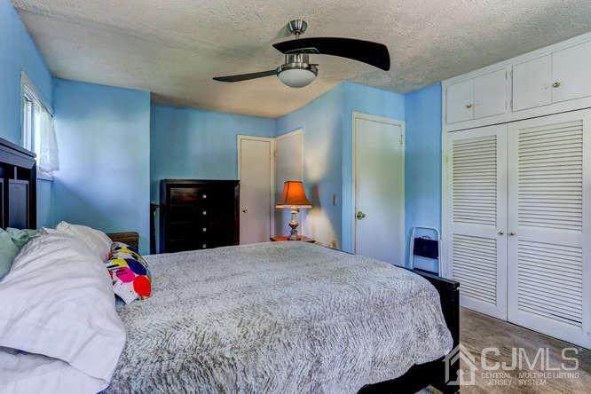 50 Ashley Road Edison, NJ 08817 - Photo 15 of 25 a bedroom with a bed and a closet