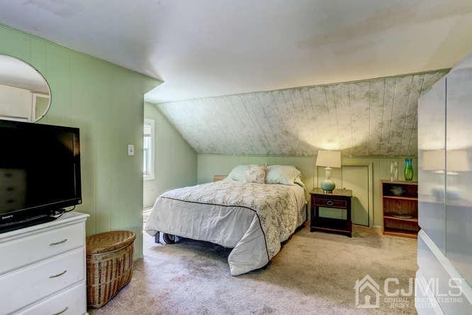50 Ashley Road Edison, NJ 08817 - Photo 17 of 25 a bedroom with a bed and flat screen tv