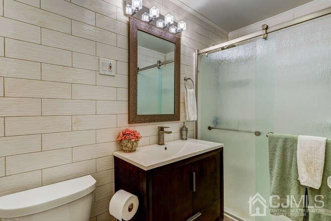 50 Ashley Road Edison, NJ 08817 - Photo 19 of 25 a bathroom with a sink toilet and shower