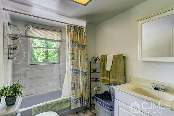 50 Ashley Road Edison, NJ 08817 - Photo 20 of 25 a bathroom with a sink and a shower