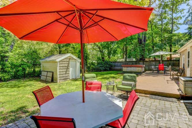 50 Ashley Road Edison, NJ 08817 - Photo 21 of 25 a view of backyard with seating space and trees