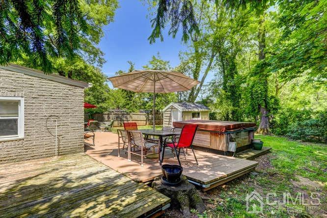 50 Ashley Road Edison, NJ 08817 - Photo 22 of 25 a view of a backyard with sitting area