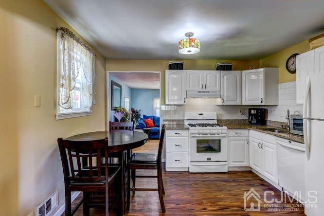 50 Ashley Road Edison, NJ 08817 - Photo 9 of 25 a kitchen with cabinets a sink and appliances