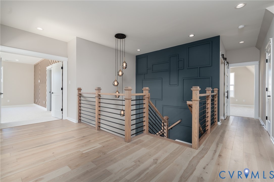 3536 Ampfield Way Midlothian, VA 23112 - Photo 26 of 49 a view of a hallway with stairs and wooden floor