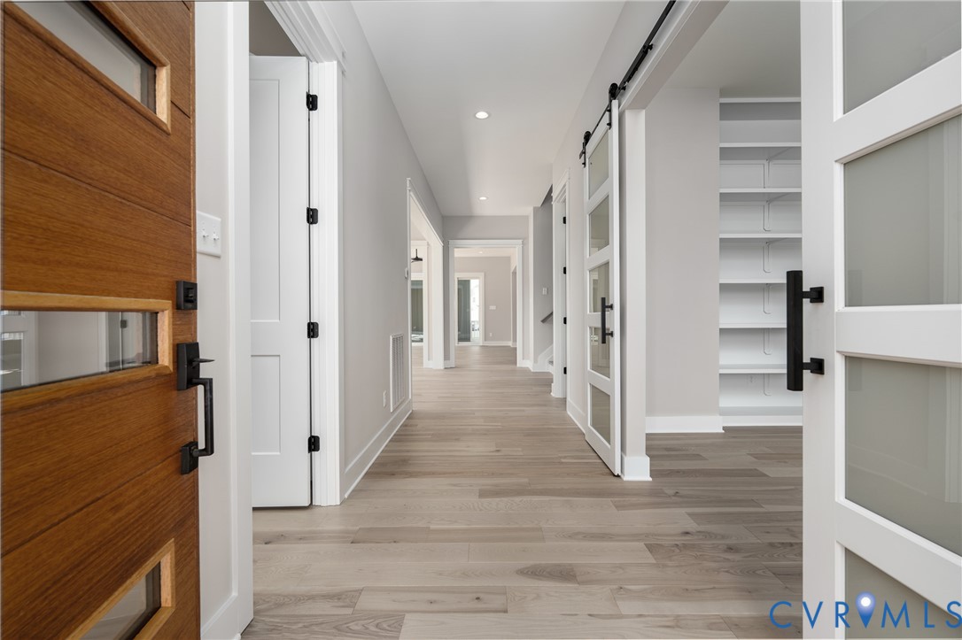 3536 Ampfield Way Midlothian, VA 23112 - Photo 4 of 49 a view of a hallway with wooden floor and staircase