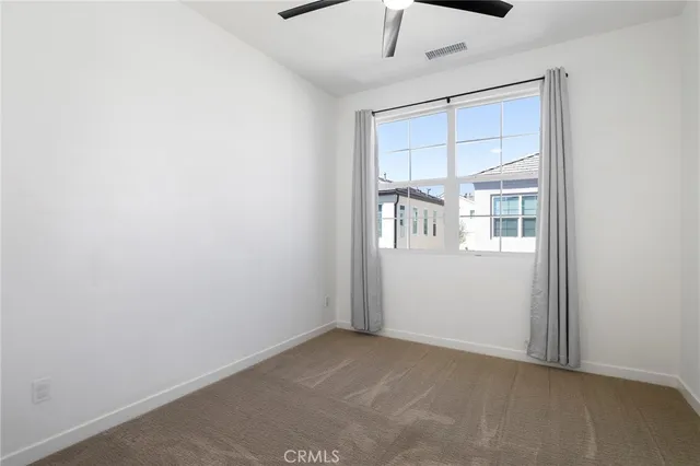 a bathroom with a double vanity sink toilet and shower