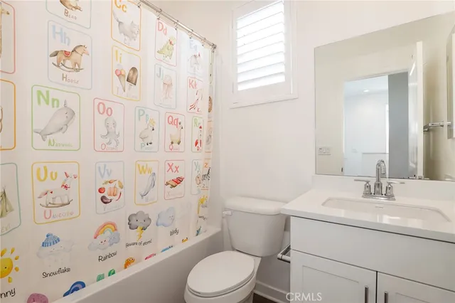a view of a kitchen with a white cabinet and a window