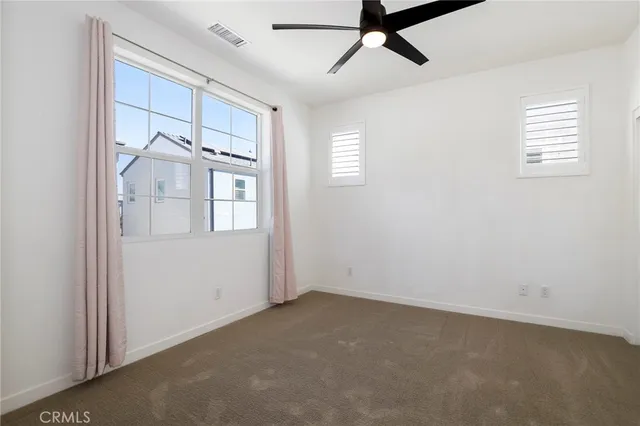 a view of a big room with entryway and stairs