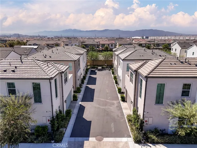 an aerial view of a residential houses with outdoor space