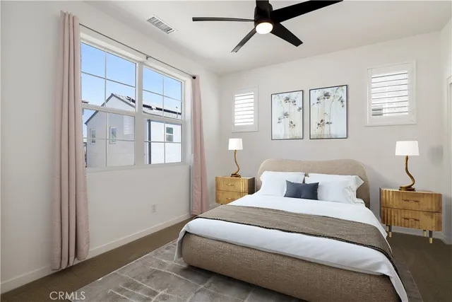 a bedroom with a large bed and a window