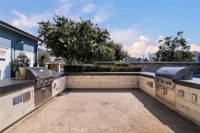 a view of a patio with table and chairs and potted plants