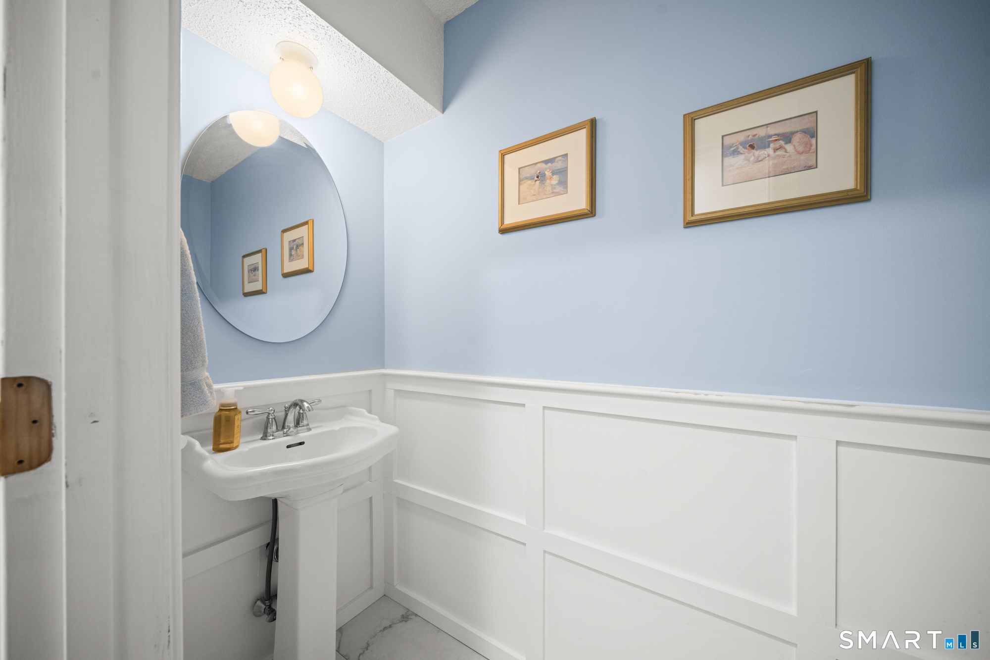 230 East Bass Lane, Unit 230 Suffield, CT 06078 - Photo 11 of 35 a bathroom with a sink and a mirror