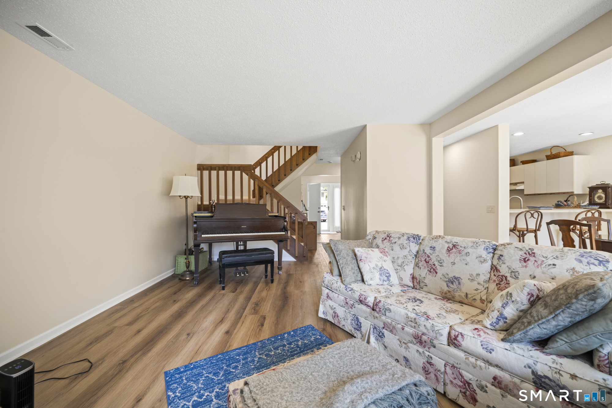 230 East Bass Lane, Unit 230 Suffield, CT 06078 - Photo 13 of 35 a living room with furniture and a piano