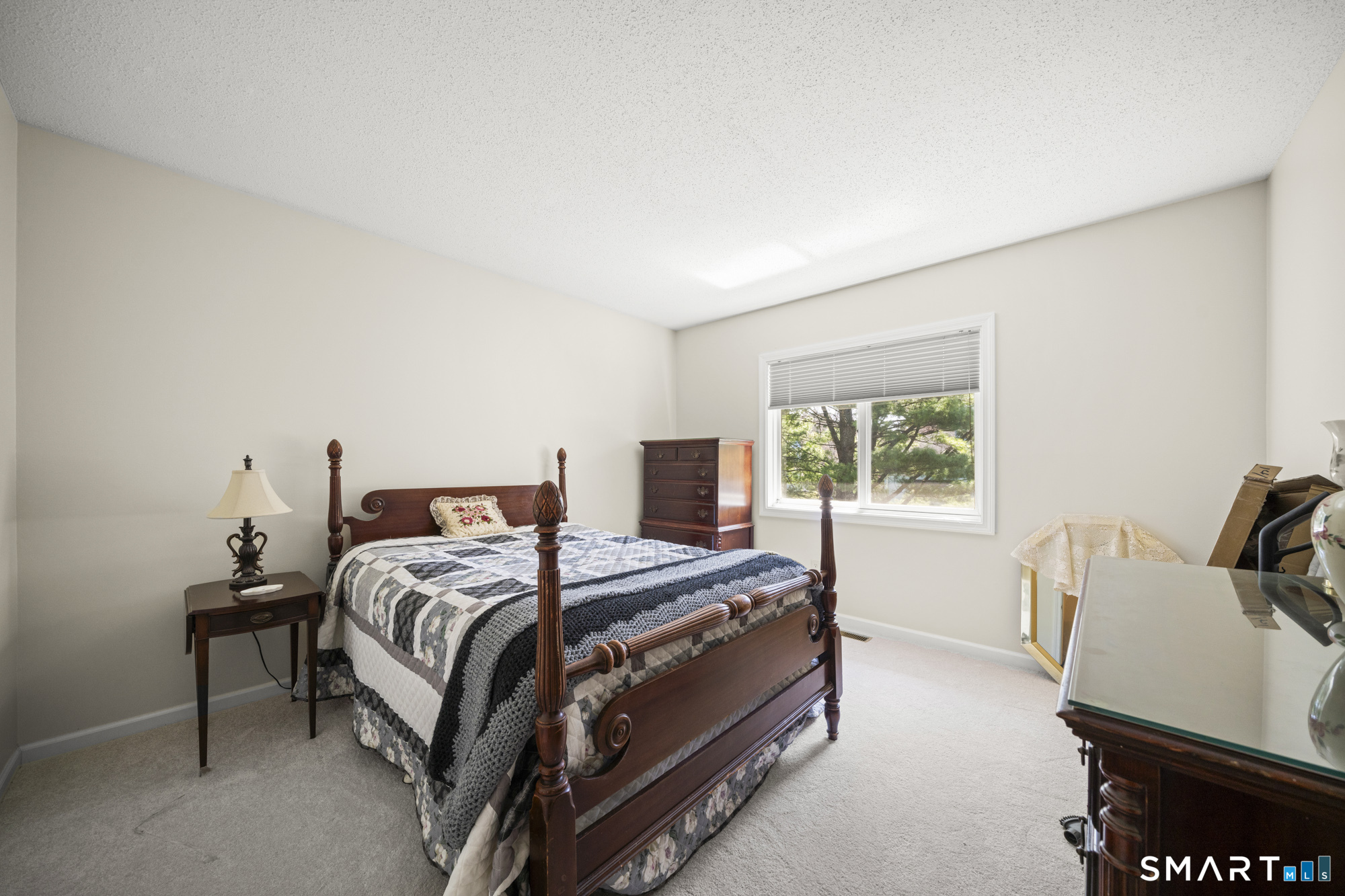 230 East Bass Lane, Unit 230 Suffield, CT 06078 - Photo 16 of 35 a bedroom with a bed and a window
