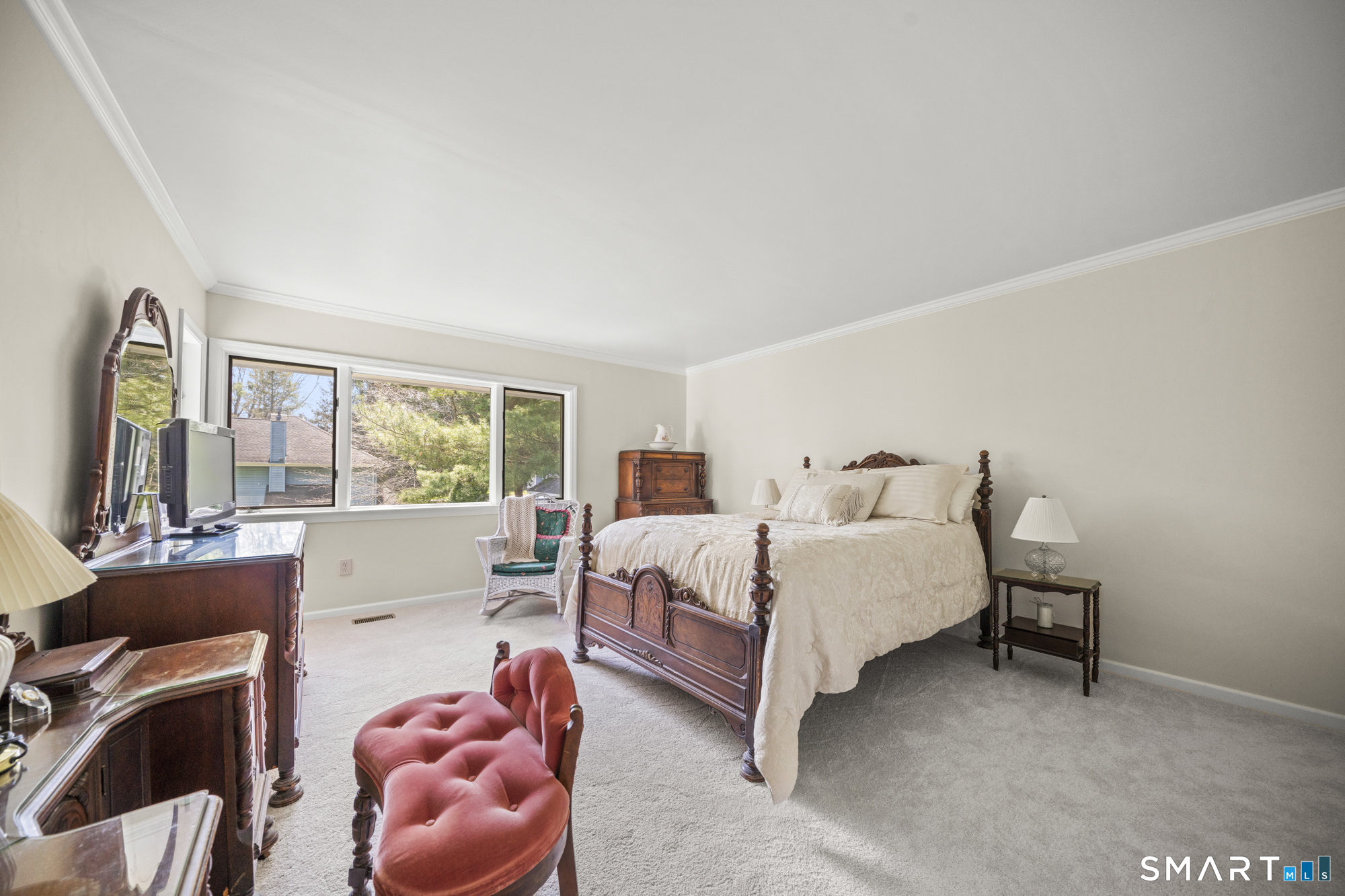 230 East Bass Lane, Unit 230 Suffield, CT 06078 - Photo 17 of 35 a bed room with a bed and a couch